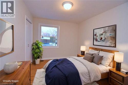 Bedroom with wood finished floors and baseboards - 510 Cumberland Avenue, Burlington, ON - Indoor Photo Showing Bedroom