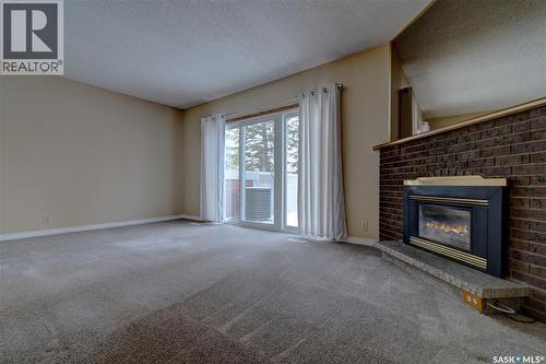 168 Plainsview Drive, Regina, SK - Indoor Photo Showing Living Room With Fireplace