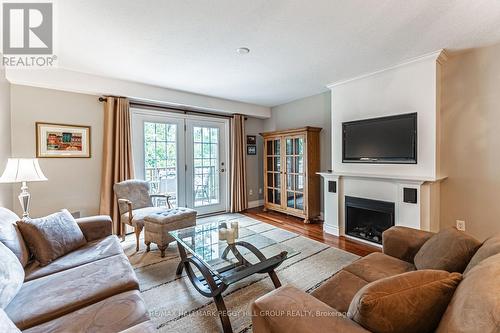 7 - 222 Steel Street, Barrie, ON - Indoor Photo Showing Living Room With Fireplace