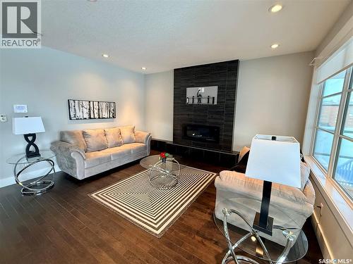 3633 Green Water Drive, Regina, SK - Indoor Photo Showing Living Room With Fireplace