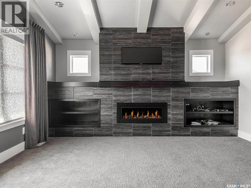 3633 Green Water Drive, Regina, SK - Indoor With Fireplace