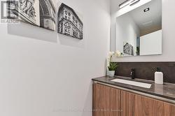 Tucked away & private main floor powder room - 