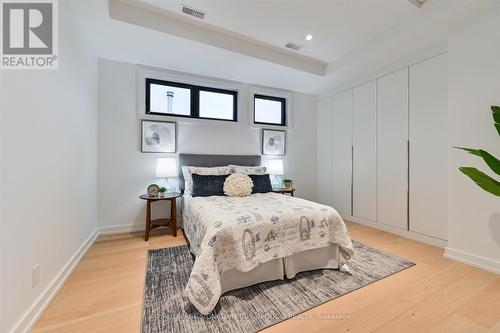 Middle bedroom features built in closets - 44 Doris Drive, Toronto, ON - Indoor Photo Showing Bedroom