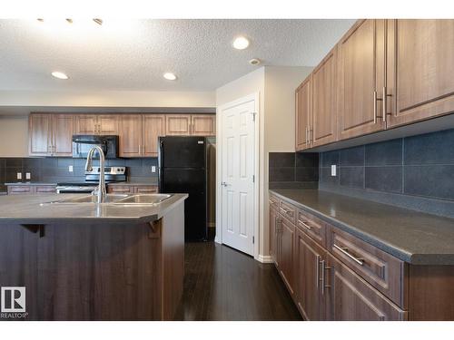 #103 655 Tamarack Rd Nw, Edmonton, AB - Indoor Photo Showing Kitchen With Double Sink