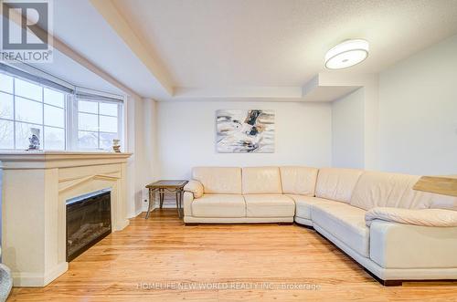 A206 - 15 Cornell Meadows Avenue, Markham, ON - Indoor Photo Showing Living Room With Fireplace