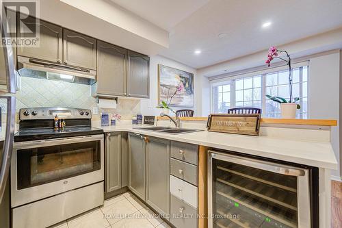 A206 - 15 Cornell Meadows Avenue, Markham, ON - Indoor Photo Showing Kitchen With Stainless Steel Kitchen With Double Sink With Upgraded Kitchen