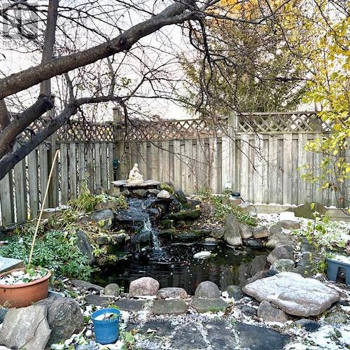 Zen-Inspired fountain with pond - 63 Acadian Heights, Brampton, ON 