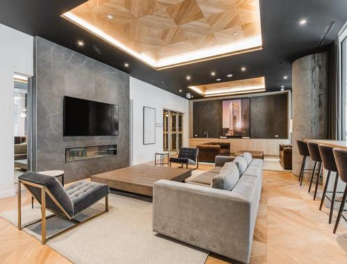 Playroom - 2305-1020 Rue De La Montagne, Montréal (Ville-Marie), QC - Indoor With Fireplace