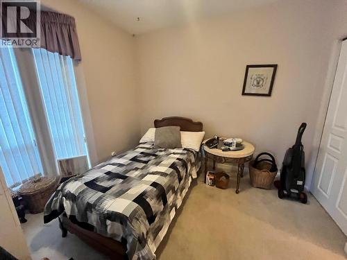 bedroom with attached open bathroom - 3221 Centennial Drive Unit# 401, Vernon, BC - Indoor Photo Showing Bedroom
