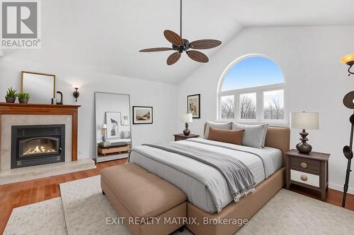 Virtually Staged - 1650 Gourley Road, East Hawkesbury, ON - Indoor Photo Showing Bedroom With Fireplace