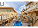250 Marina Way Unit# 208, Penticton, BC  - Outdoor With In Ground Pool With Exterior 