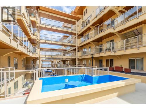 250 Marina Way Unit# 208, Penticton, BC - Outdoor With In Ground Pool With Exterior