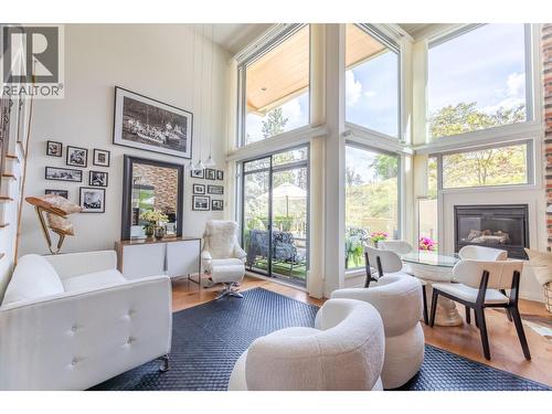 250 Marina Way Unit# 208, Penticton, BC - Indoor Photo Showing Living Room With Fireplace