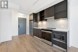 Modern Kitchen Features Whirlpool S/S Appliances - 