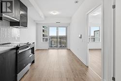 Wide-Plank Laminate Flooring Throughout - 