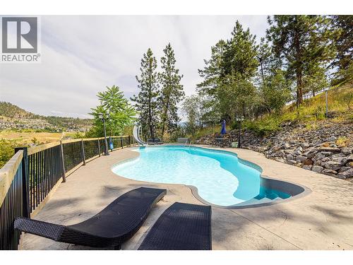 1791 Sprucegrove Court, Kelowna, BC - Outdoor With In Ground Pool With Backyard