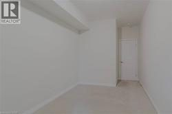 Unfurnished room featuring baseboards and light carpet - 
