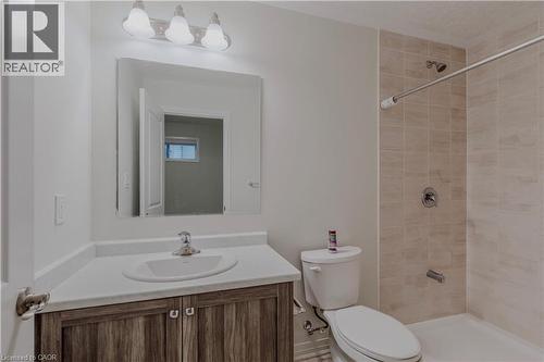 Bathroom with toilet, vanity, and a tile shower - 25 Isherwood Avenue Unit# G105, Cambridge, ON - Indoor Photo Showing Bathroom