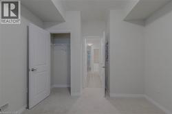 Unfurnished bedroom featuring visible vents, baseboards, a closet, and light carpet - 
