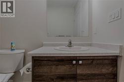 Bathroom featuring toilet and vanity - 