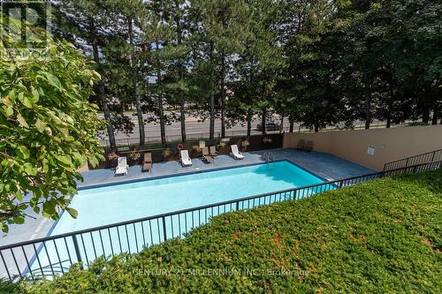604 - 5 Lisa Street, Brampton, ON - Outdoor With In Ground Pool