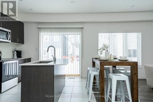 Patio doors walk out to fenced yard - 17 Catamaran Drive, Wasaga Beach, ON 