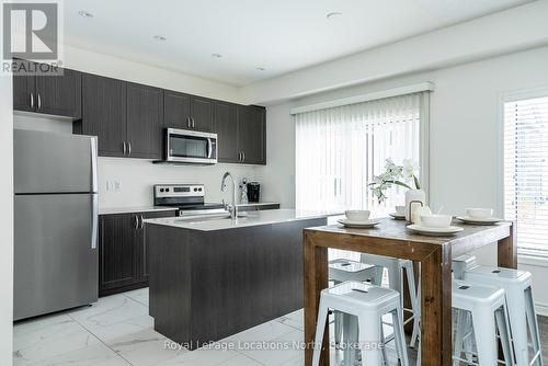 Kitchen with island seating - 17 Catamaran Drive, Wasaga Beach, ON 