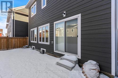 Patio doors enter into the kitchen - 17 Catamaran Drive, Wasaga Beach, ON 