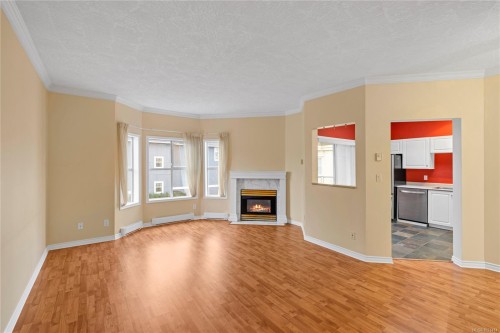 406-220 Island Hwy West, Parksville, BC - Indoor Photo Showing Living Room With Fireplace