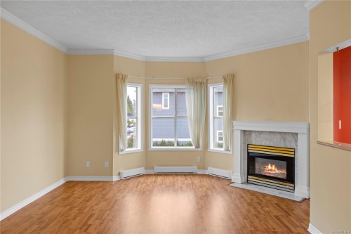 406-220 Island Hwy West, Parksville, BC - Indoor Photo Showing Other Room With Fireplace