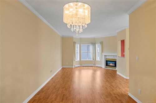 406-220 Island Hwy West, Parksville, BC - Indoor Photo Showing Other Room With Fireplace