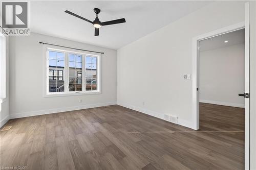 Empty room featuring wood finished floors and ceiling fan - 7 South Court Street W, Norwich, ON - Indoor Photo Showing Other Room