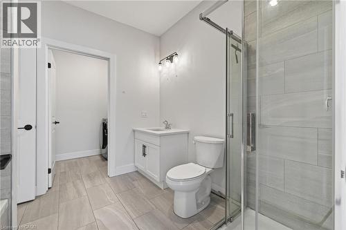 Full bath with vanity, a stall shower, and washer / dryer - 7 South Court Street W, Norwich, ON - Indoor Photo Showing Bathroom