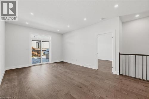 Spare room featuring dark wood-type flooring and recessed lighting - 4 Elgin Street W, Norwich, ON - Indoor Photo Showing Other Room