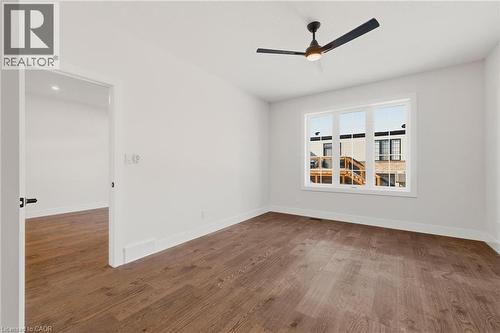 Spare room featuring dark wood-style floors and ceiling fan - 4 Elgin Street W, Norwich, ON - Indoor Photo Showing Other Room