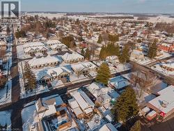 Snowy aerial view featuring a residential view - 