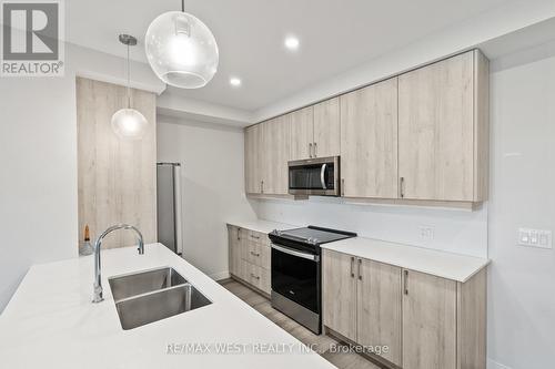 502 - 118 West Street, Port Colborne, ON - Indoor Photo Showing Kitchen With Double Sink