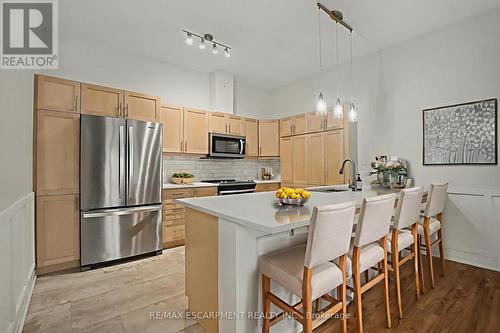 VIRTUALLY STAGED - 006 - 39 Sister Varga Terrace, Hamilton, ON - Indoor Photo Showing Kitchen