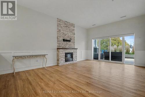 006 - 39 Sister Varga Terrace, Hamilton, ON - Indoor Photo Showing Living Room With Fireplace