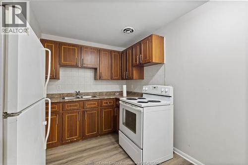 1400-1430 Seneca Street, Windsor, ON - Indoor Photo Showing Kitchen With Double Sink