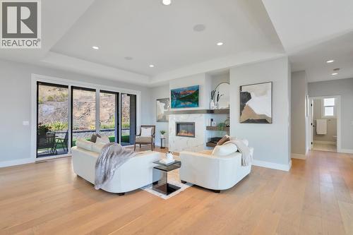 Interior & exterior speakers installed throughout the home - 2594 Crown Crest Drive, West Kelowna, BC - Indoor Photo Showing Living Room With Fireplace