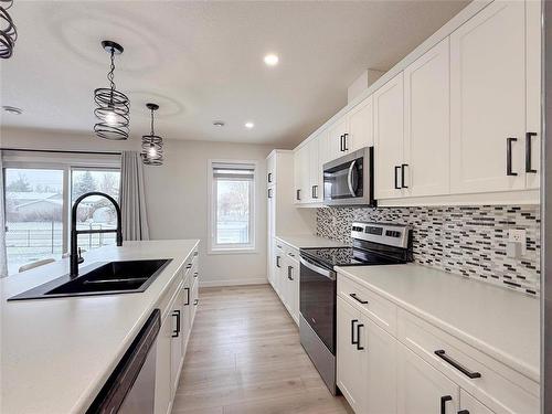 51 Dietrich Bay, Brandon, MB - Indoor Photo Showing Kitchen With Double Sink With Upgraded Kitchen