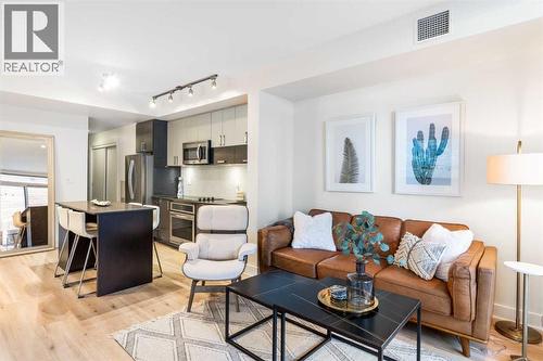 Living room - 303, 550 Riverfront Avenue Se, Calgary, AB - Indoor