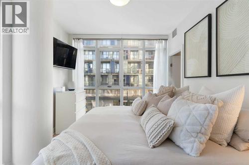 Primary - 303, 550 Riverfront Avenue Se, Calgary, AB - Indoor Photo Showing Bedroom
