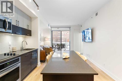 303, 550 Riverfront Avenue Se, Calgary, AB - Indoor Photo Showing Kitchen With Upgraded Kitchen