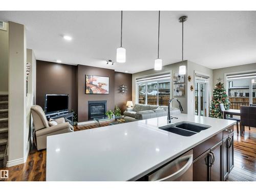 5512 Allbright Sq Sw, Edmonton, AB - Indoor Photo Showing Kitchen With Fireplace With Double Sink With Upgraded Kitchen