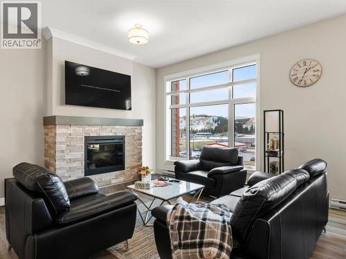 405-36 Waterfront Place, Whitehorse, YT - Indoor Photo Showing Living Room With Fireplace