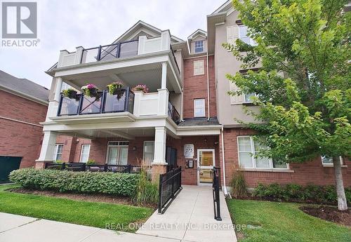 301 - 275 Littlewood Drive, Oakville, ON - Outdoor With Balcony With Facade