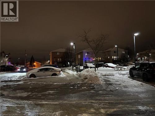 View of snow covered parking - 50 Howe Drive Unit# 12A, Kitchener, ON - 