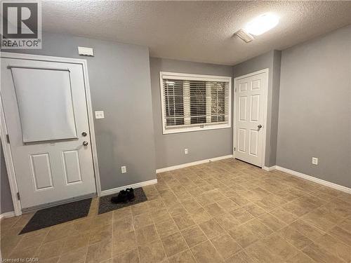 Entryway featuring a textured ceiling - 50 Howe Drive Unit# 12A, Kitchener, ON - Indoor Photo Showing Other Room